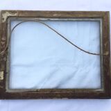 Gilded wooden frame and its glass