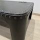 Industrial coffee table in riveted metal from around 1920 – black patina – 145 × 80 cm