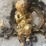 Pediment cherub musician