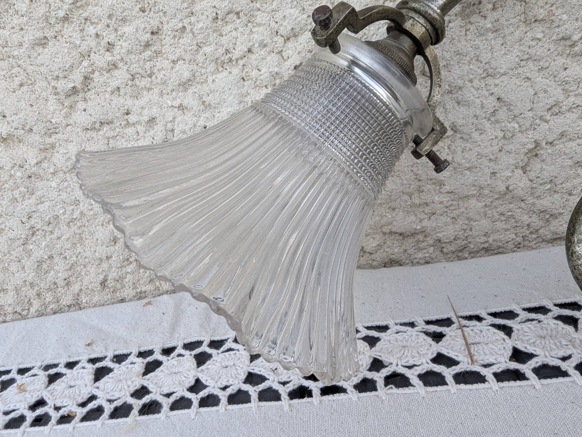 Vintage wall sconce in brass with Holophane glass tulip.