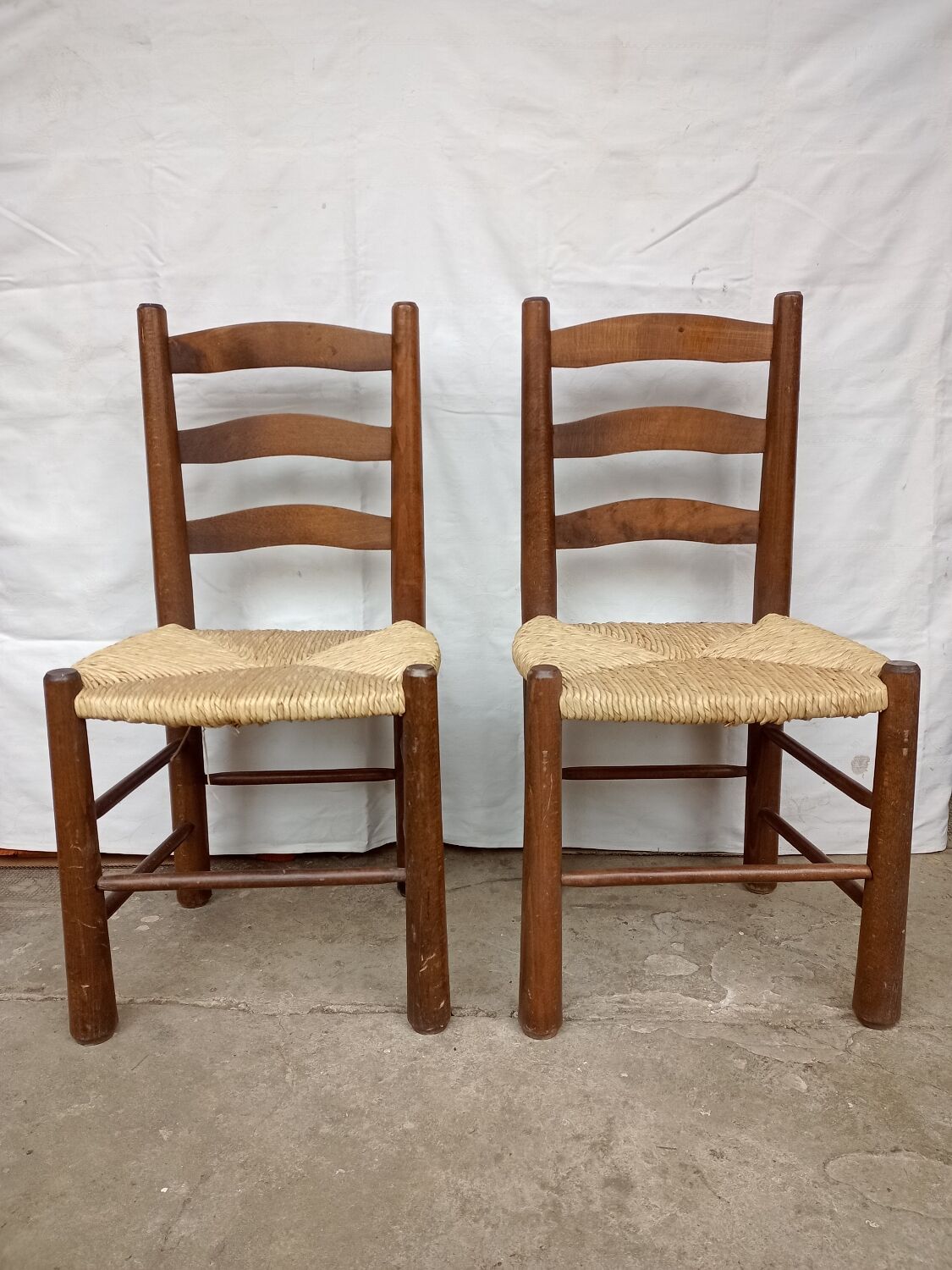 Brutalist chairs in walnut and straw