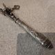 Silver metal handle in the style of Louis XVI.