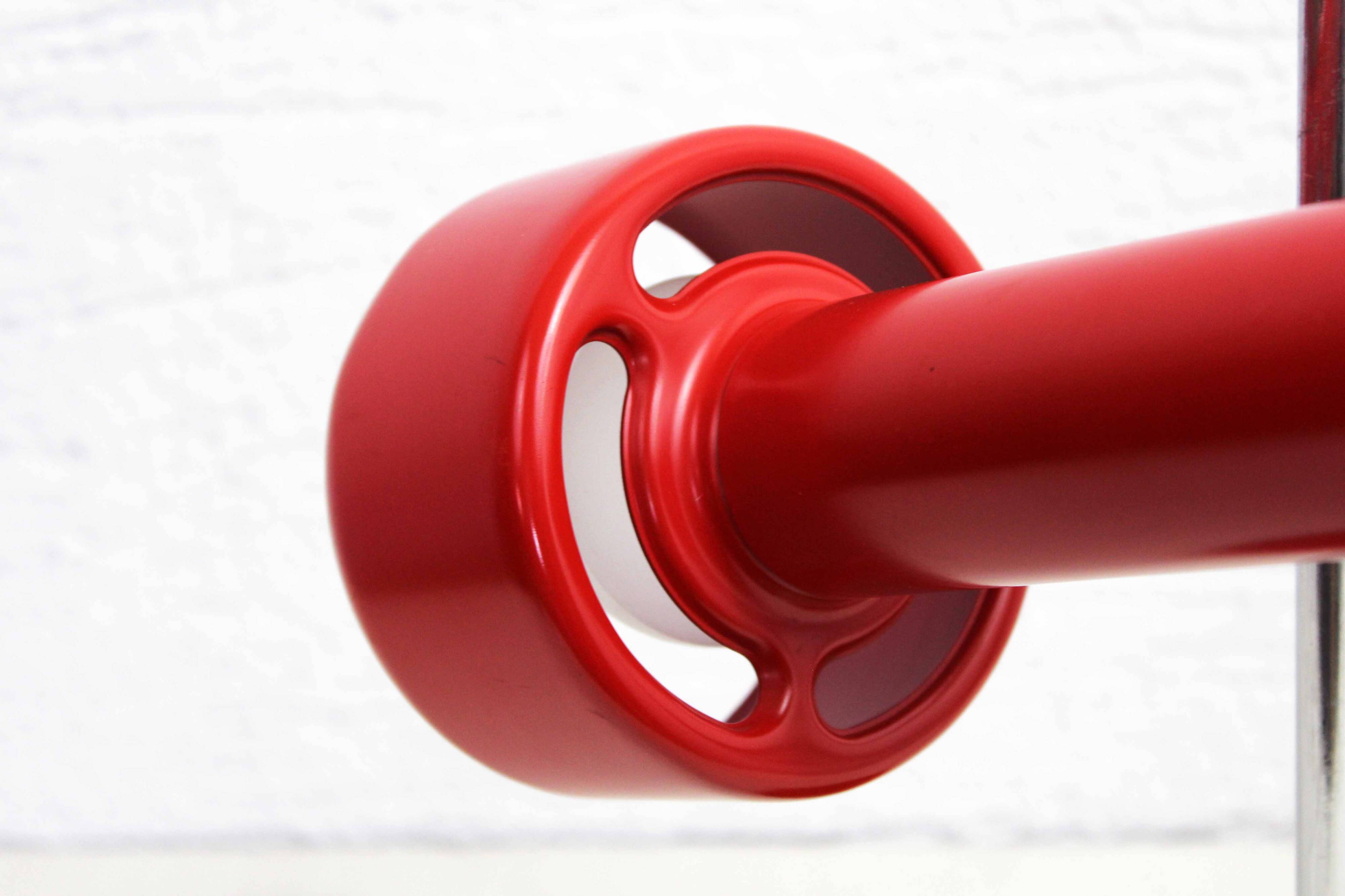 Red metal articulated desk lamp