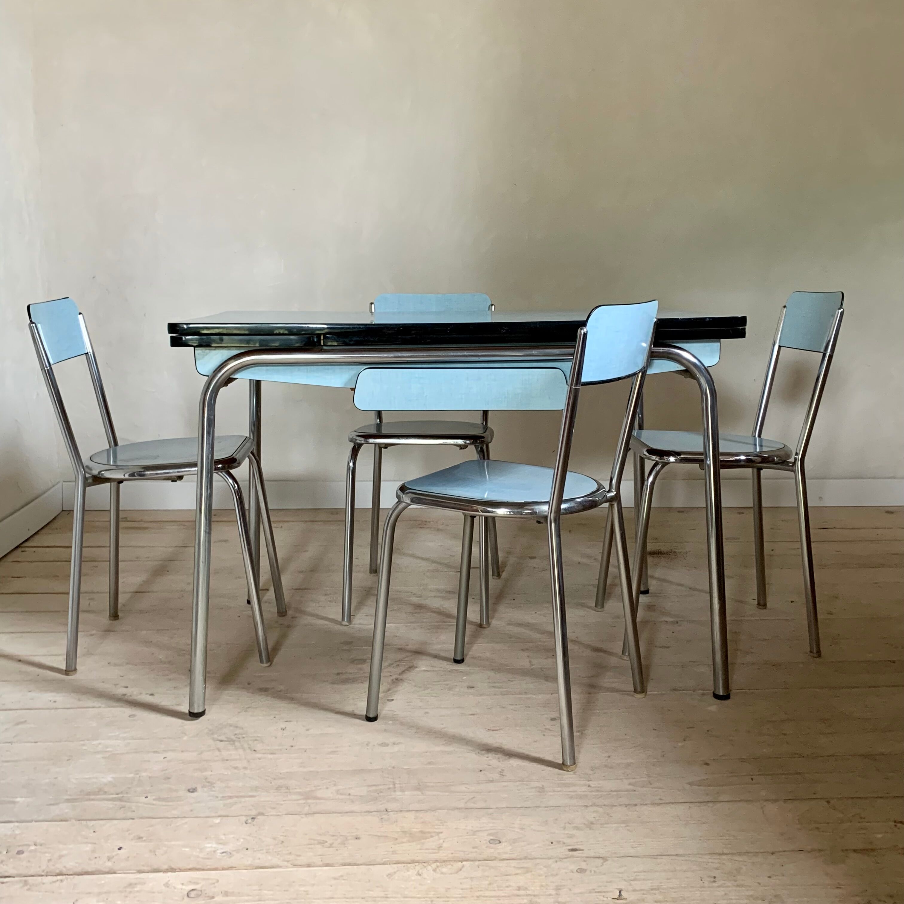 Blue formica table and its 4 chairs