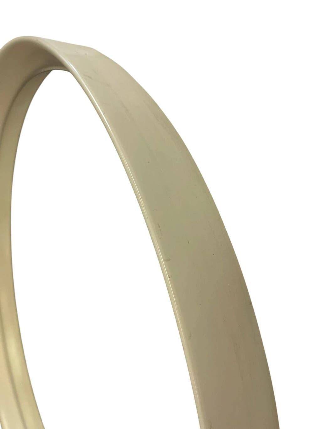 Beige vintage round mirror in a space style / wall mirror
