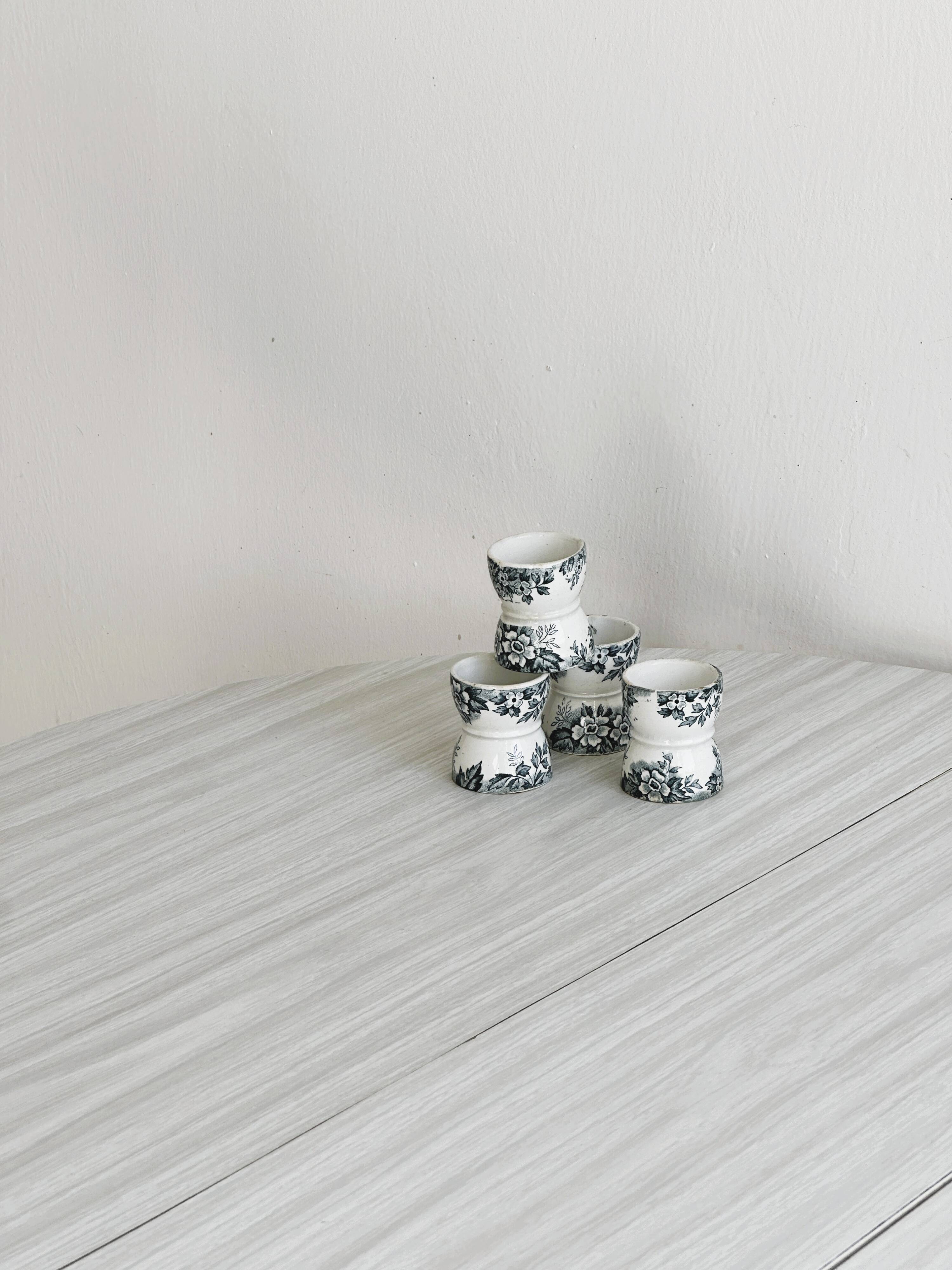 Set of 4 antique earthenware egg cups