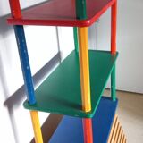 Shelf on legs, library, crayons in 4 colours.