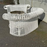 Rattan lounge with two two-seater sofas and a white coffee table.