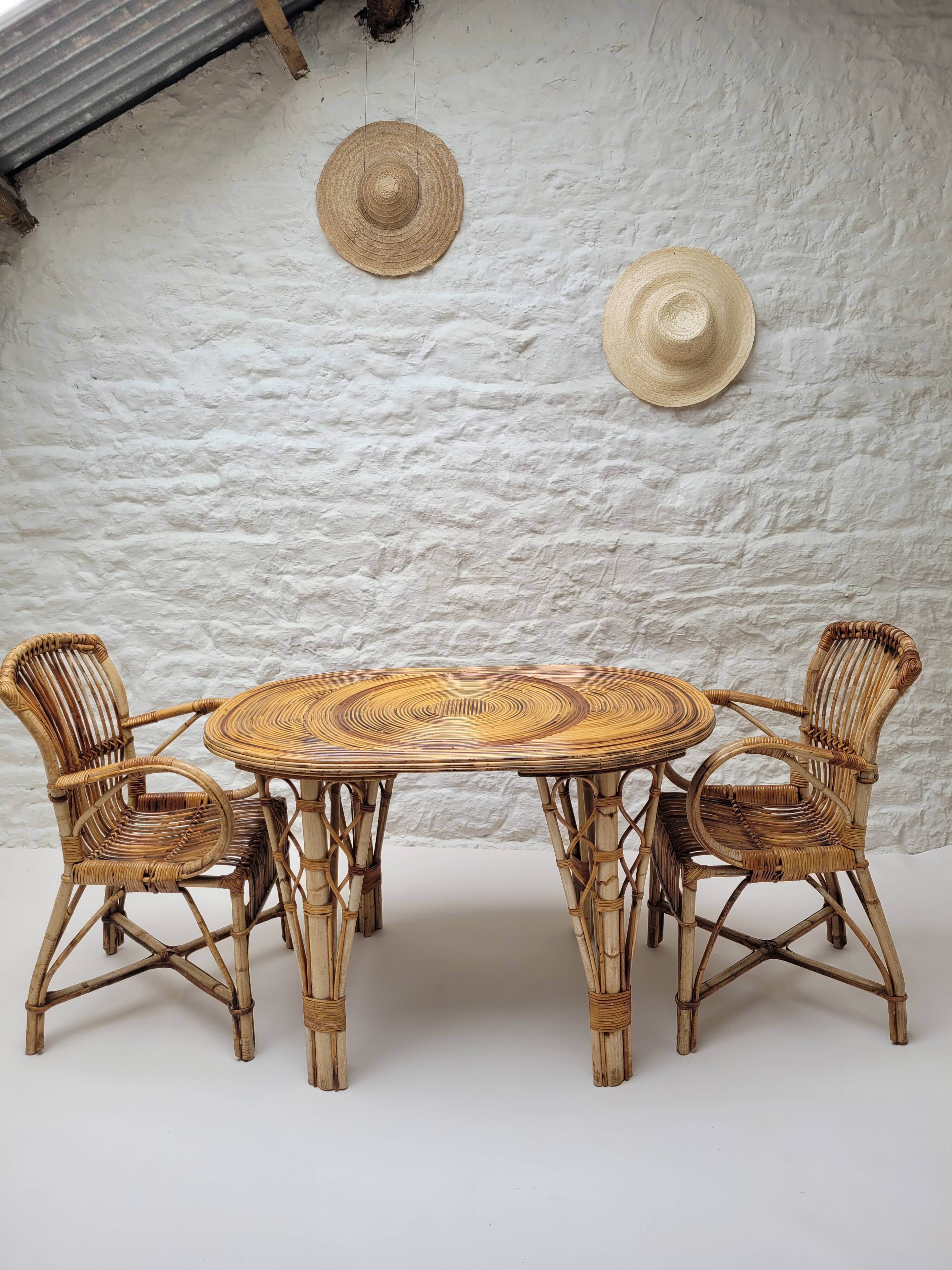 Vintage Audoux Minet bamboo, rattan, and smoked glass table duo.
