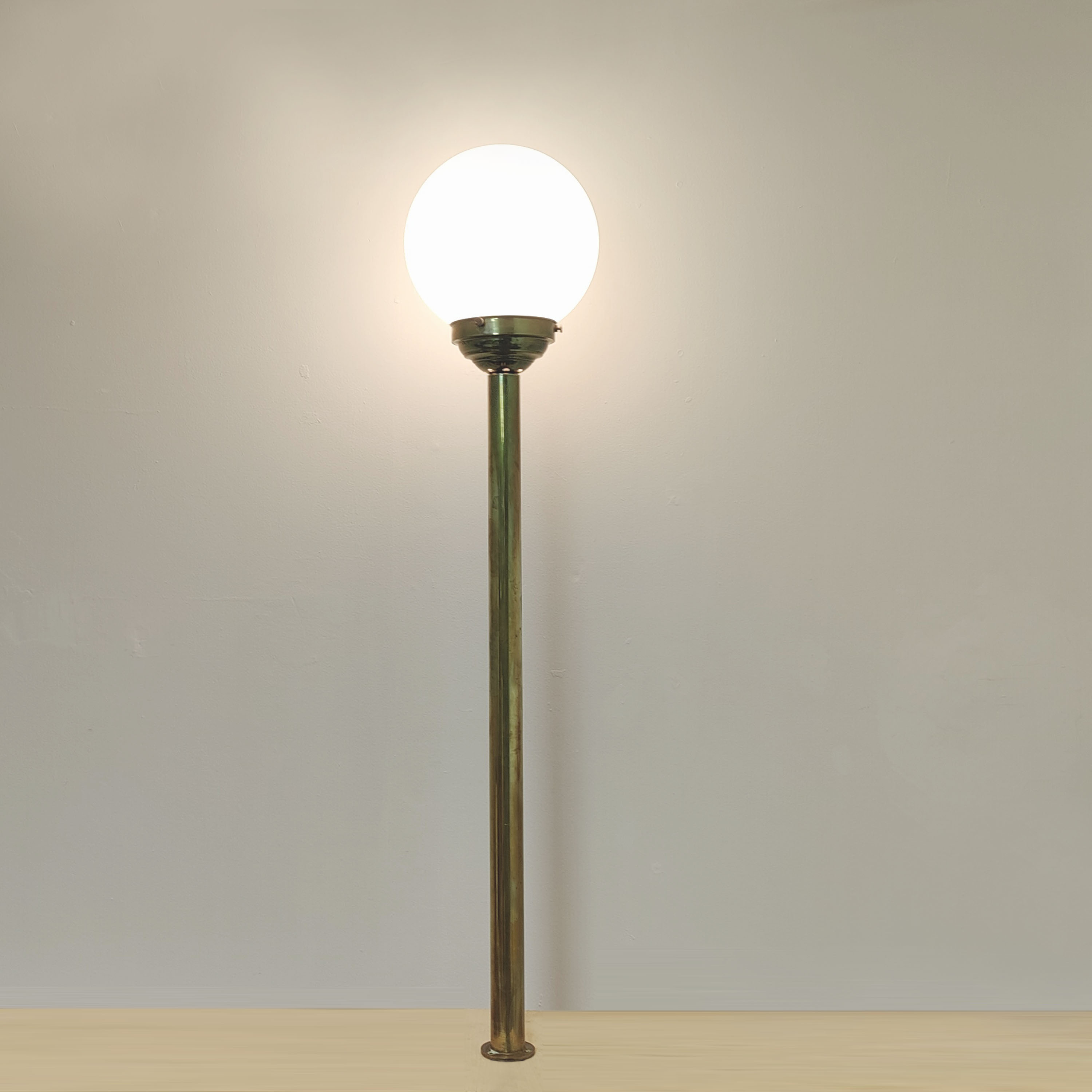 Brass brasserie floor lamp with opaline glass globe