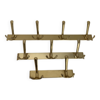 Three vintage 1960s gold coat racks with 4, 3 and 2 hooks