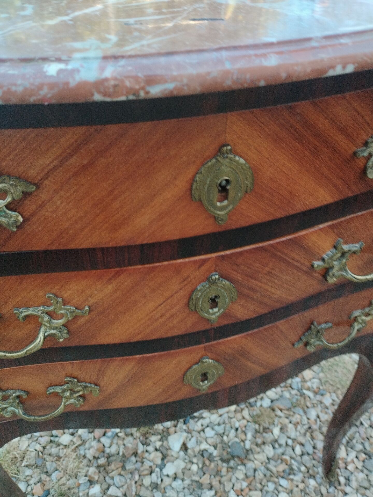 Antique marquetry commode with marble top in Louis XVI style.
