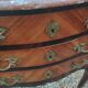 Antique marquetry commode with marble top in Louis XVI style.
