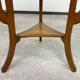 Round Art Nouveau coffee table with a sculpted top.