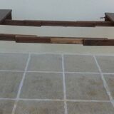 Round mahogany table with mahogany veneer and brass sabot foot.