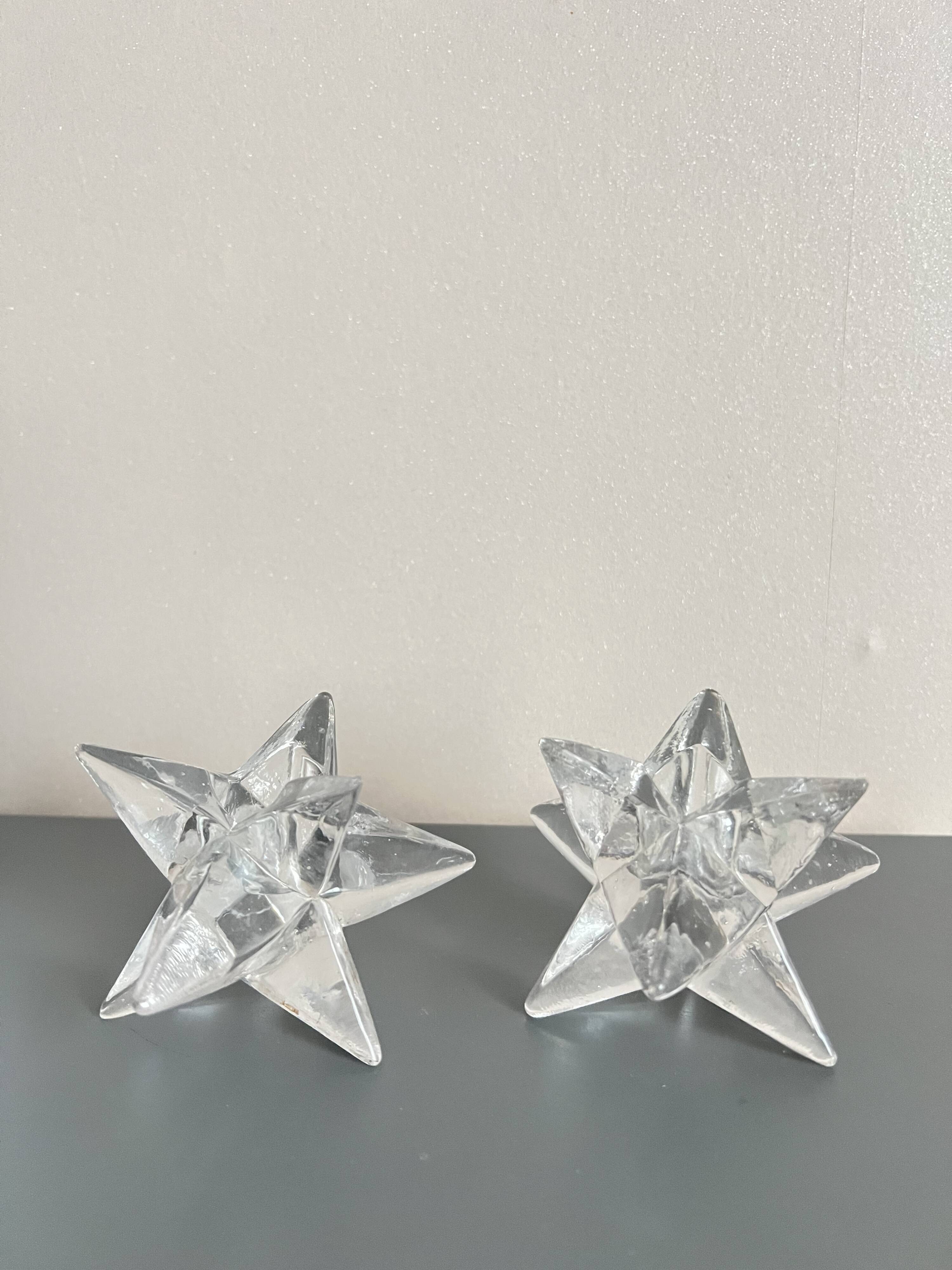 Set of two transparent glass star candle holders