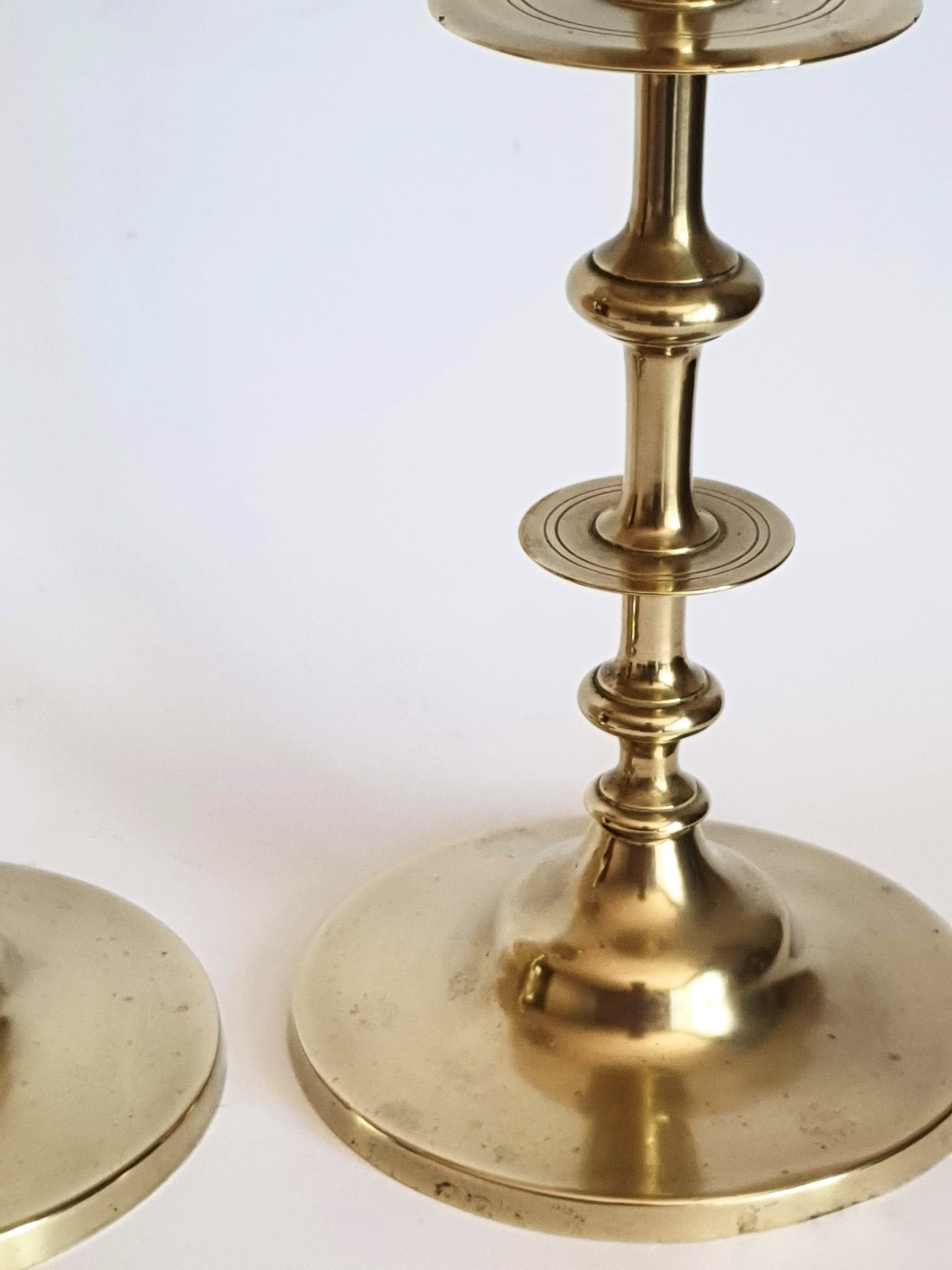 Duo of brass candle holders