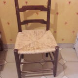 2 wooden and straw chairs