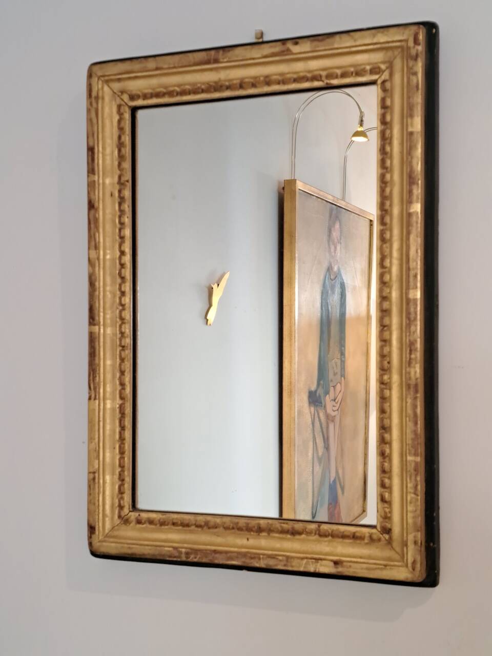 Antique mirror in wood and gilded stucco
