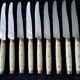 10 Vintage Bakelite, brass and stainless steel cheese knives
