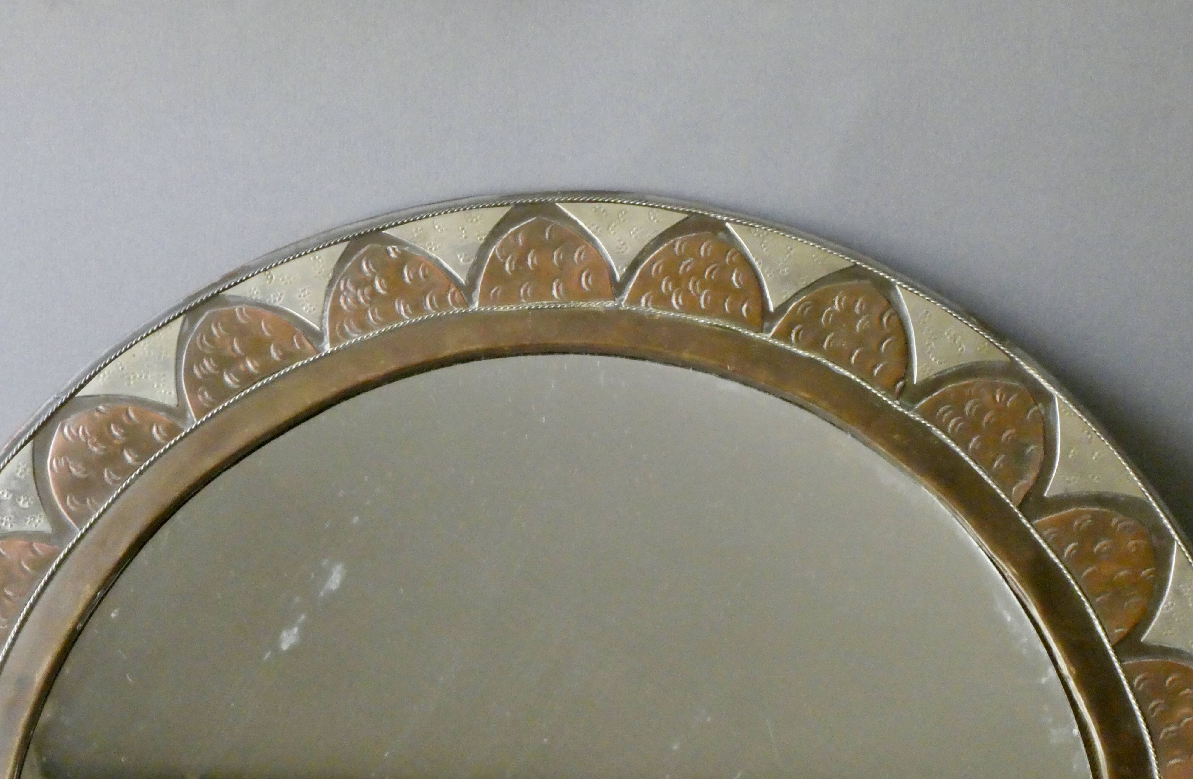 Large round Moroccan mirror in chiseled brass and copper, 1970s-1980s