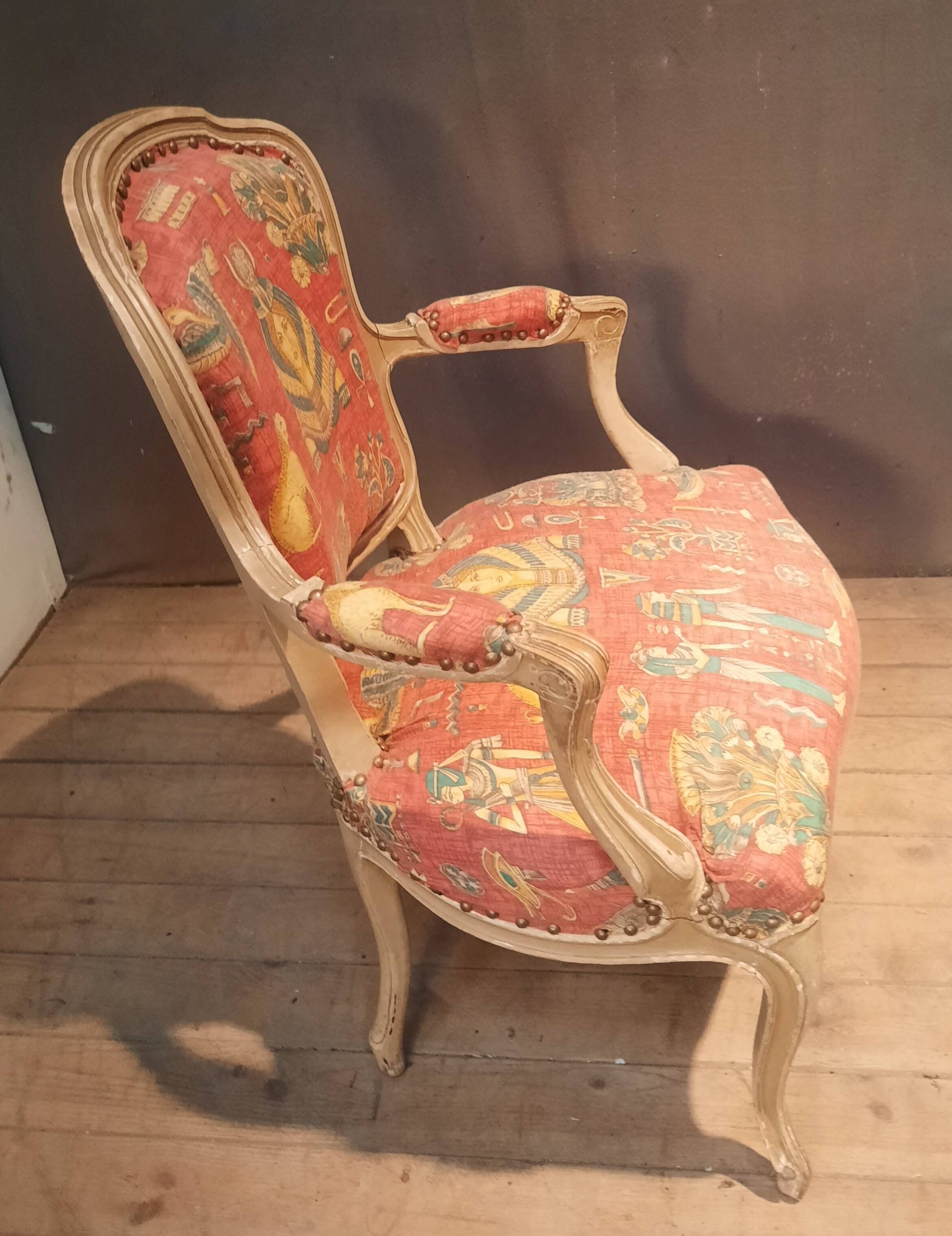 Louis XV style armchair upholstered with an Egyptian pattern.