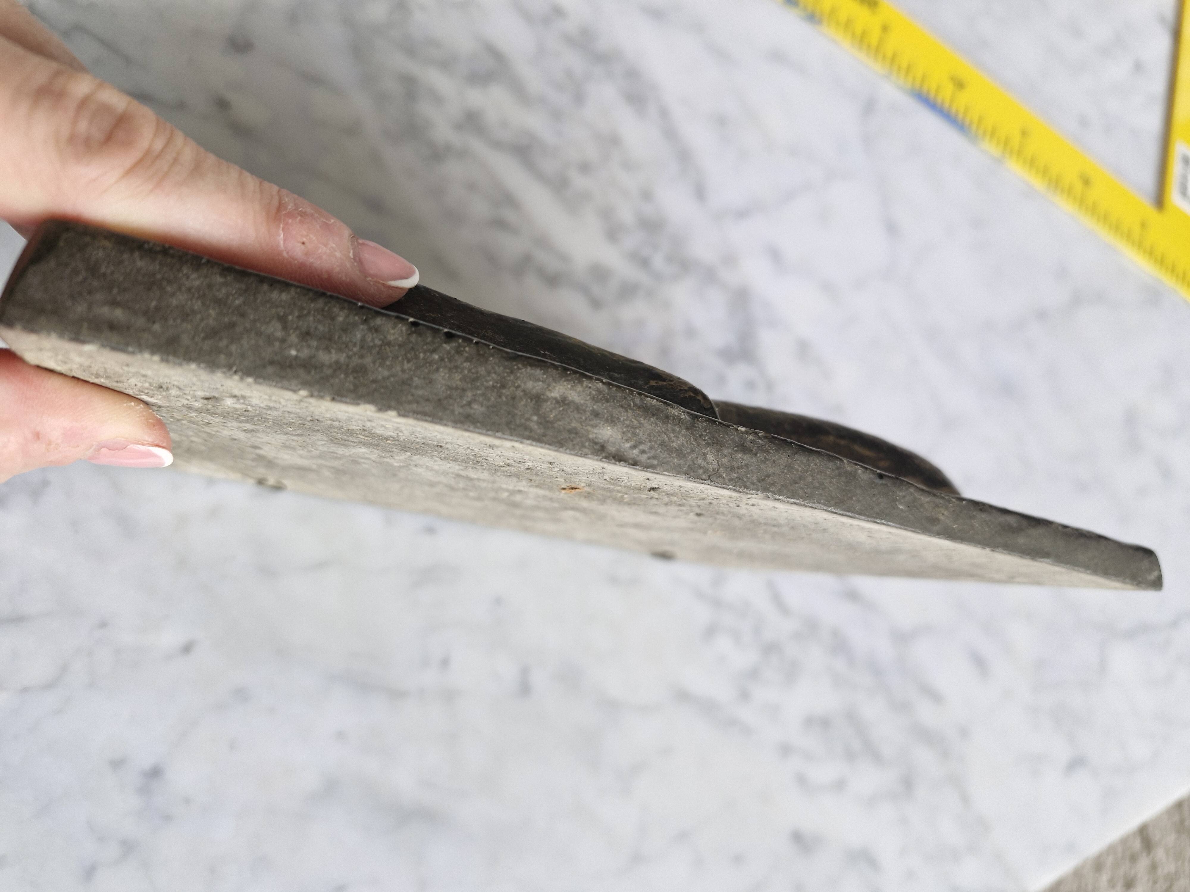 Bas-relief plaque of a rabbit in brown patina, seated cat