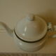 Teapot or coffee maker in old enamelled sheet metal