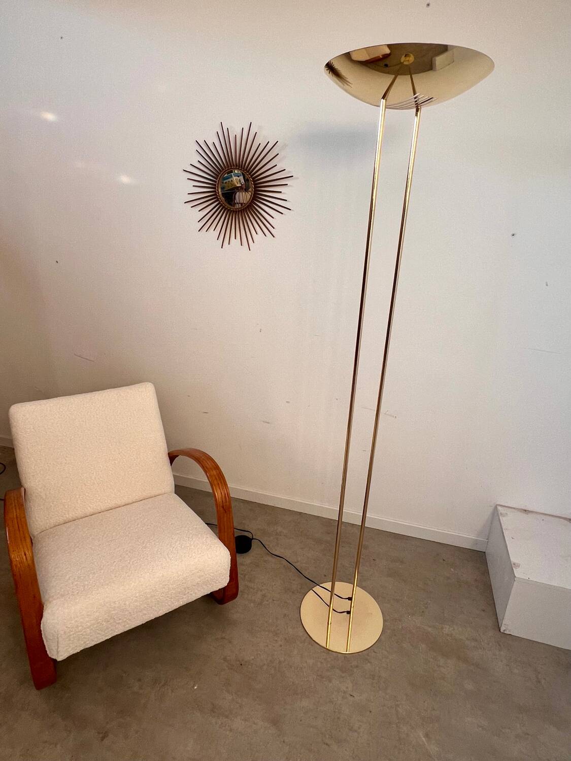 Old golden brass floor lamp with Italian design bulb from the 70s vintage