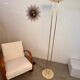 Old golden brass floor lamp with Italian design bulb from the 70s vintage