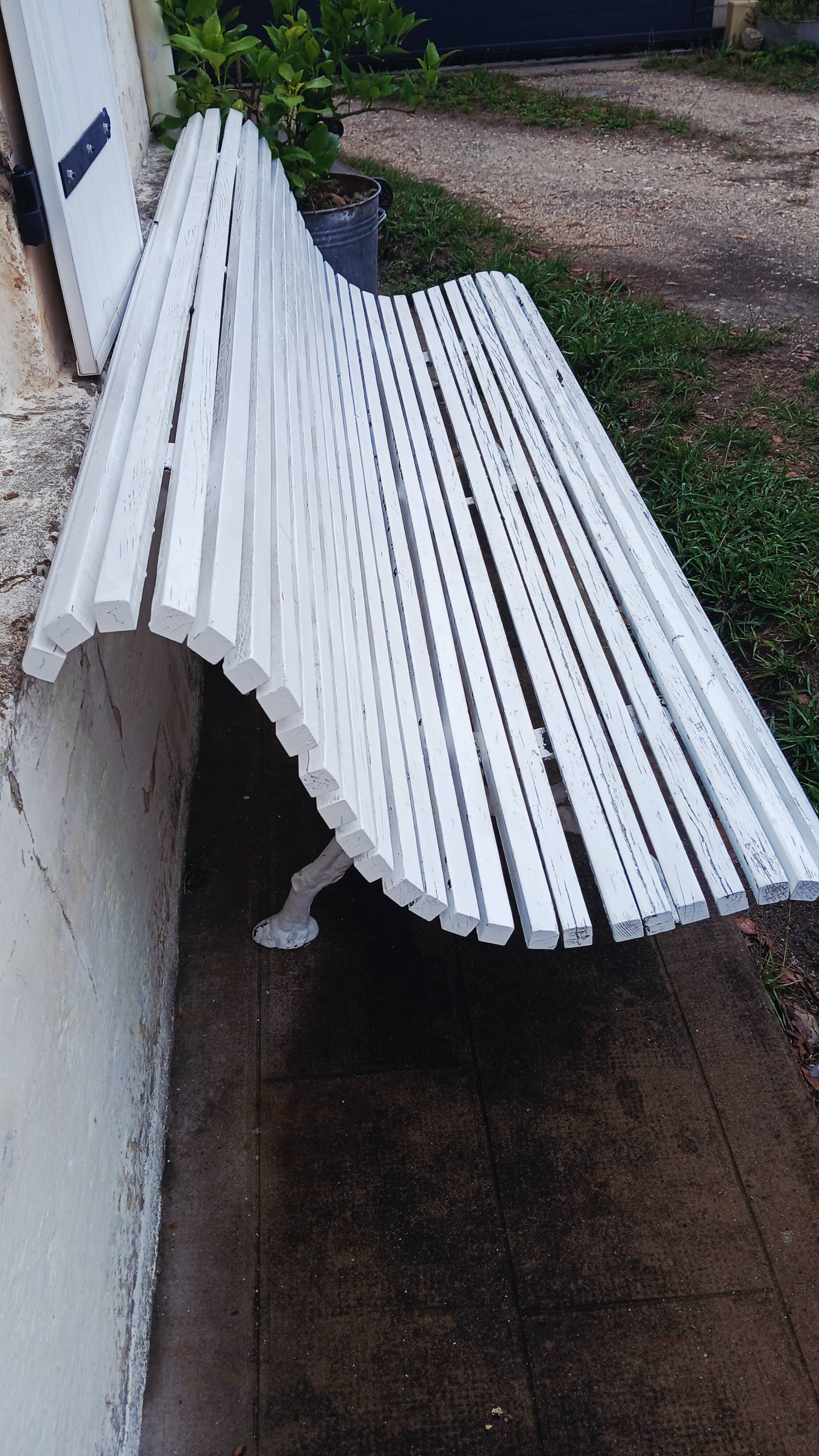Cast iron and wooden slat garden bench from the early 20th century