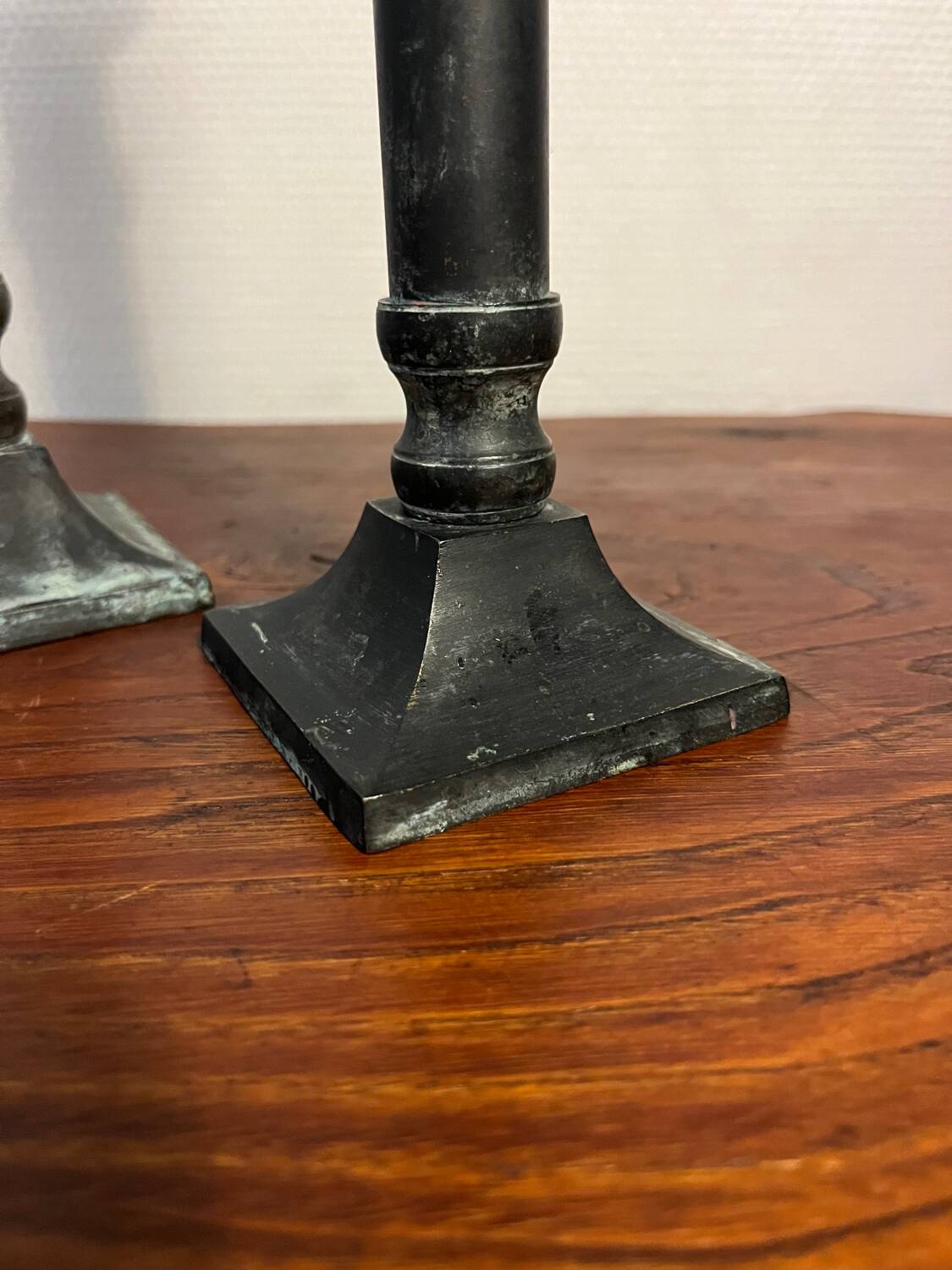 Pair of removable patinated brass candlesticks