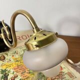 Swan neck wall light in brass with glass tulip.