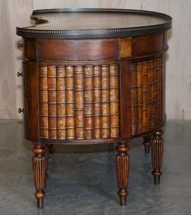 Regency style hardwood and leather kidney desk with gallery.