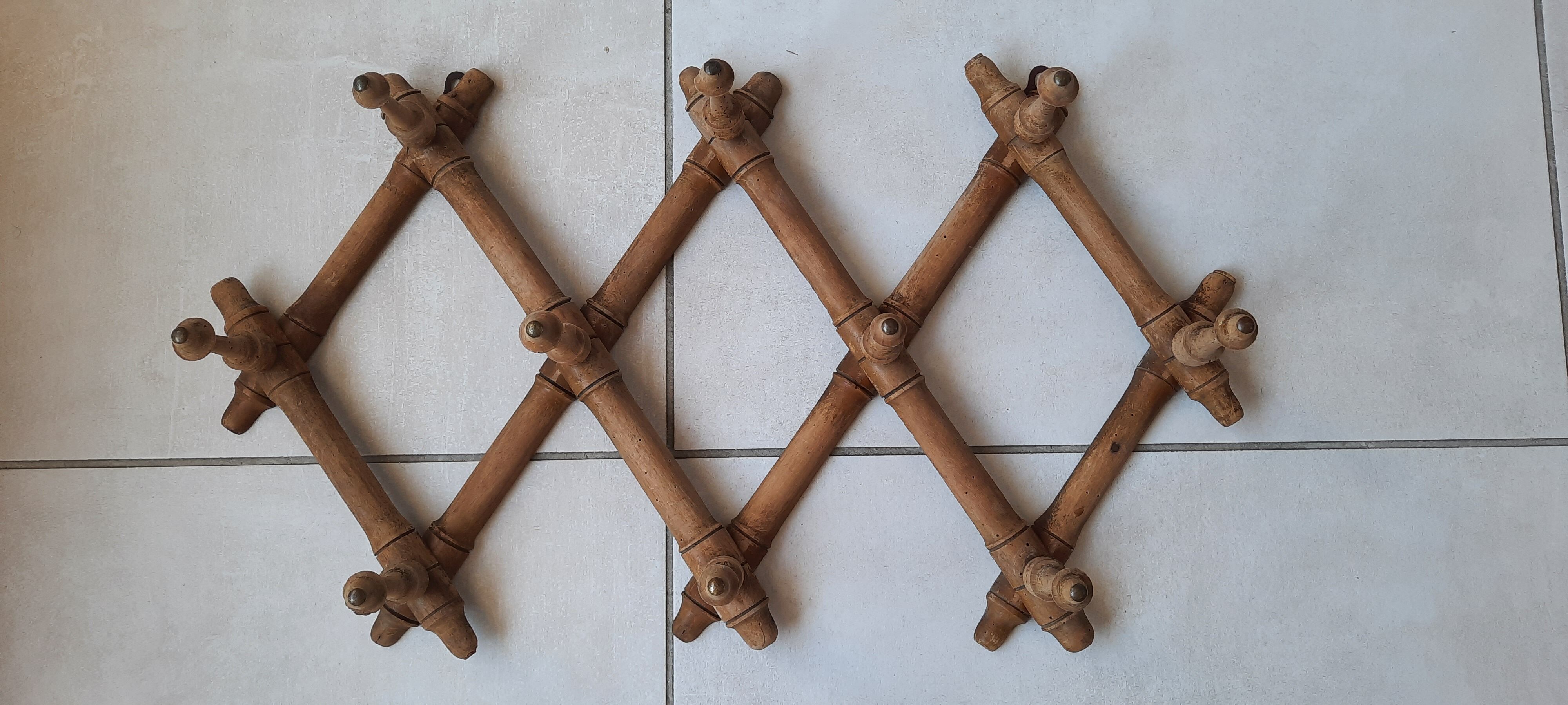 Old accordion wall coat rack