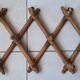 Old accordion wall coat rack