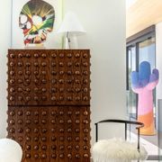Italian brutalist-style bar made of wood and glass, drinks cabinet.