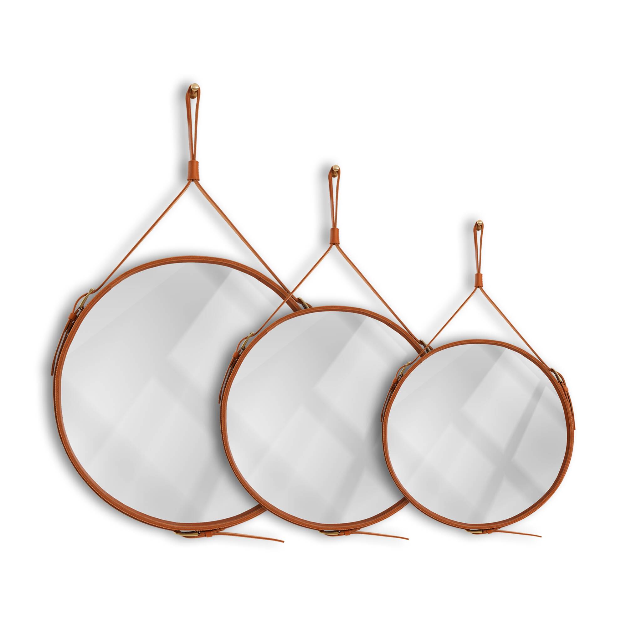 Handmade mirror in J. Adnet style, made of vegetable-tanned leather in tan colour, ø 45 cm.