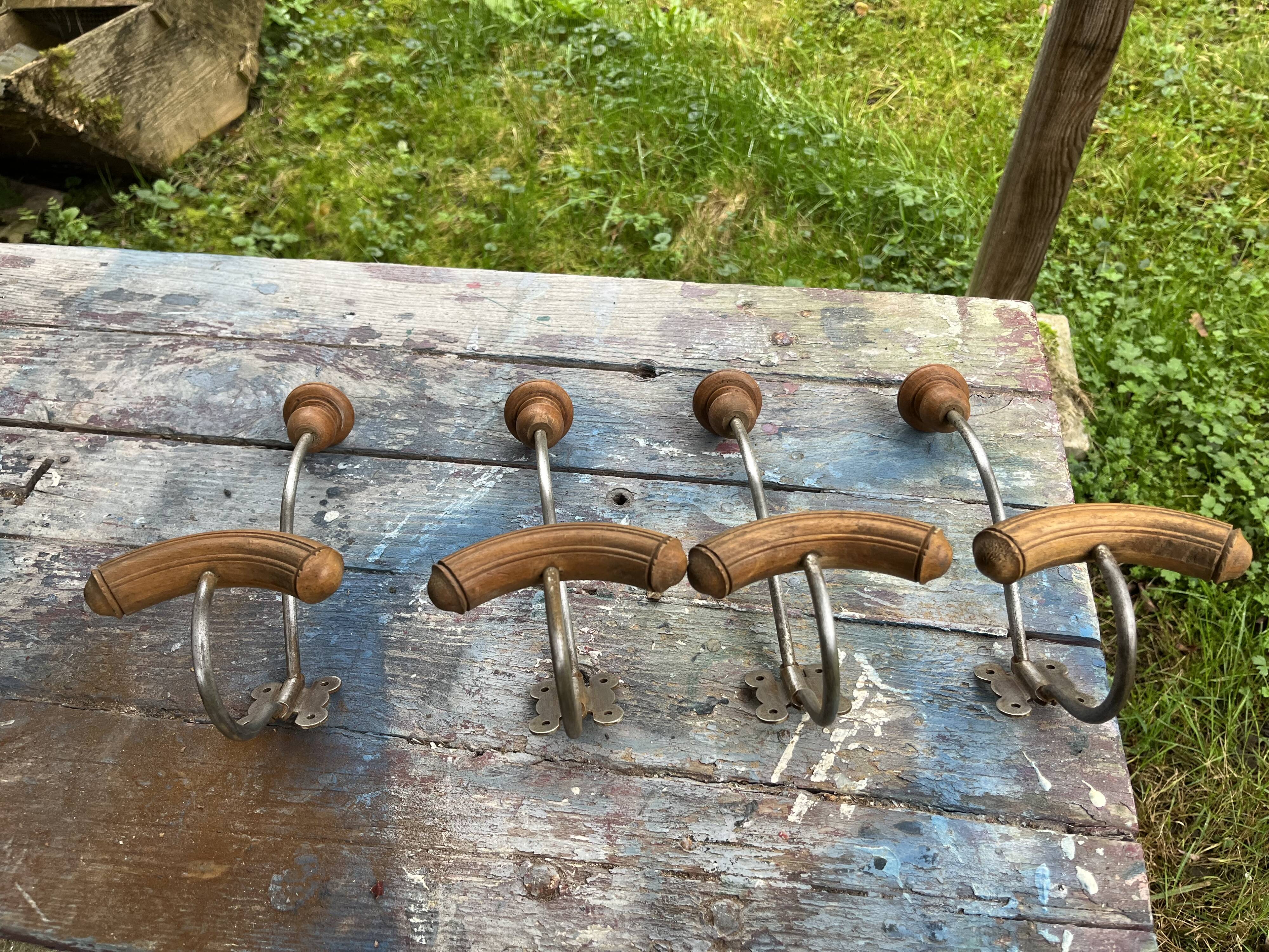 Set of 4 wooden and iron coat hooks from the 60s