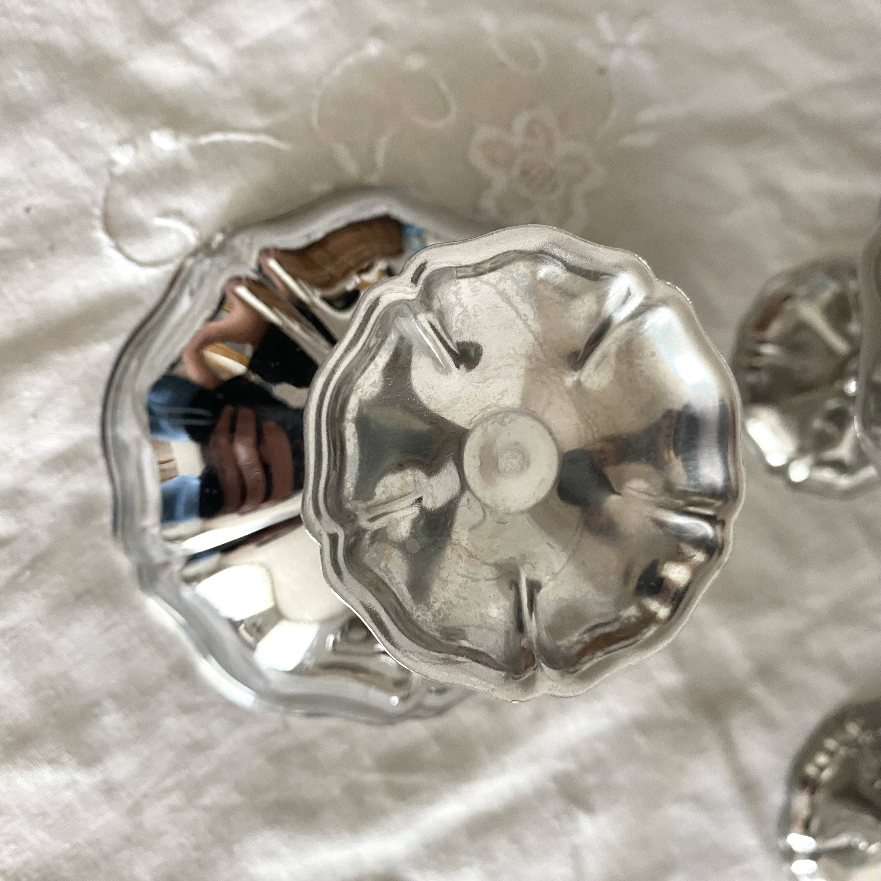 Vintage stainless steel cups on foot