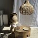 Suspension or rattan lampshade in the shape of a woven bulb.