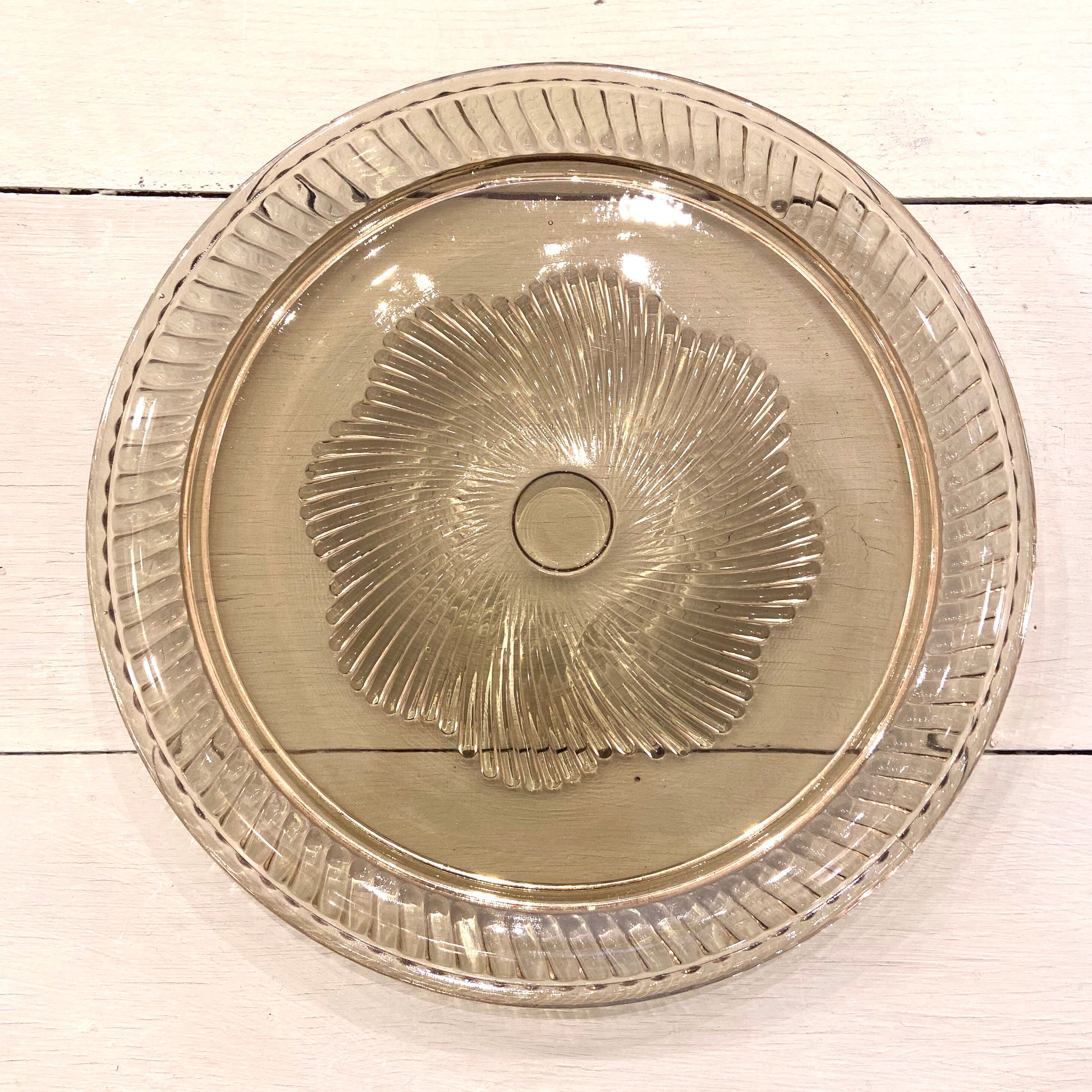 Plat rond en verre gris fumé