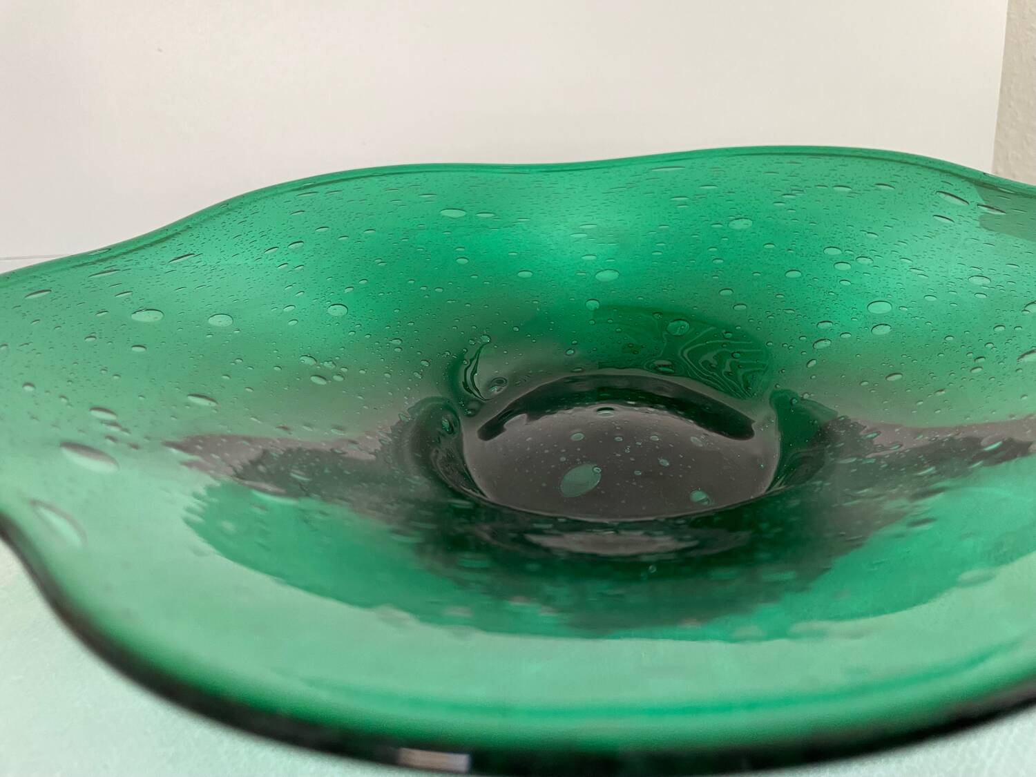 Green glass dish by Max Verboeket