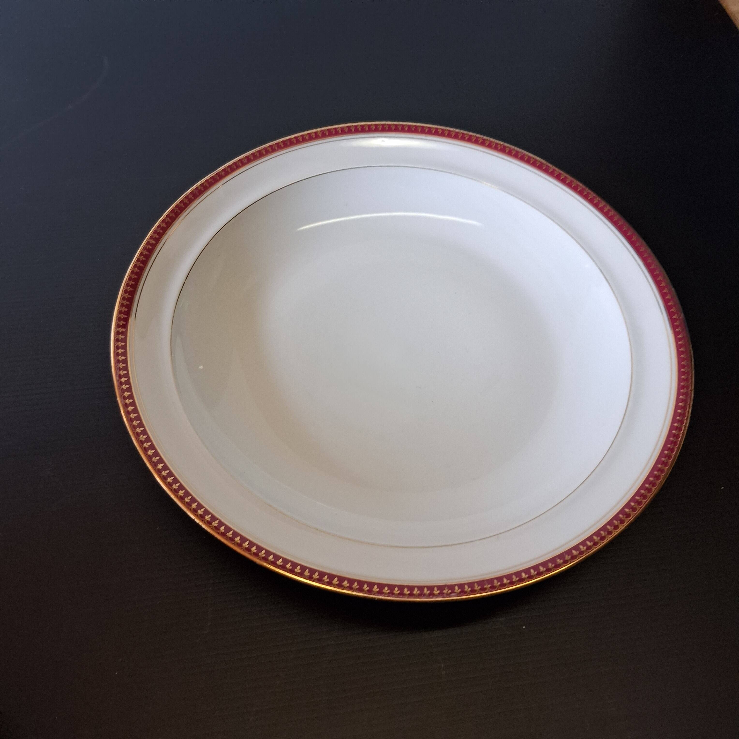 Round hollow serving plate in porcelain from Chastagner et Cie in good condition.
