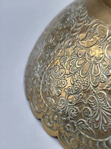Engraved brass bowl from the mid-20th century with a scalloped edge.