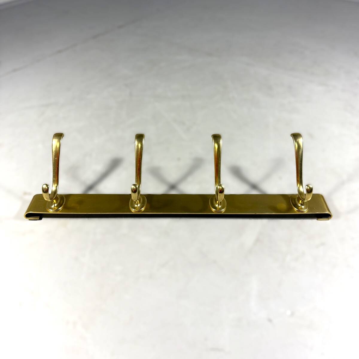 Gold coloured aluminium wall coat rack 1960’s