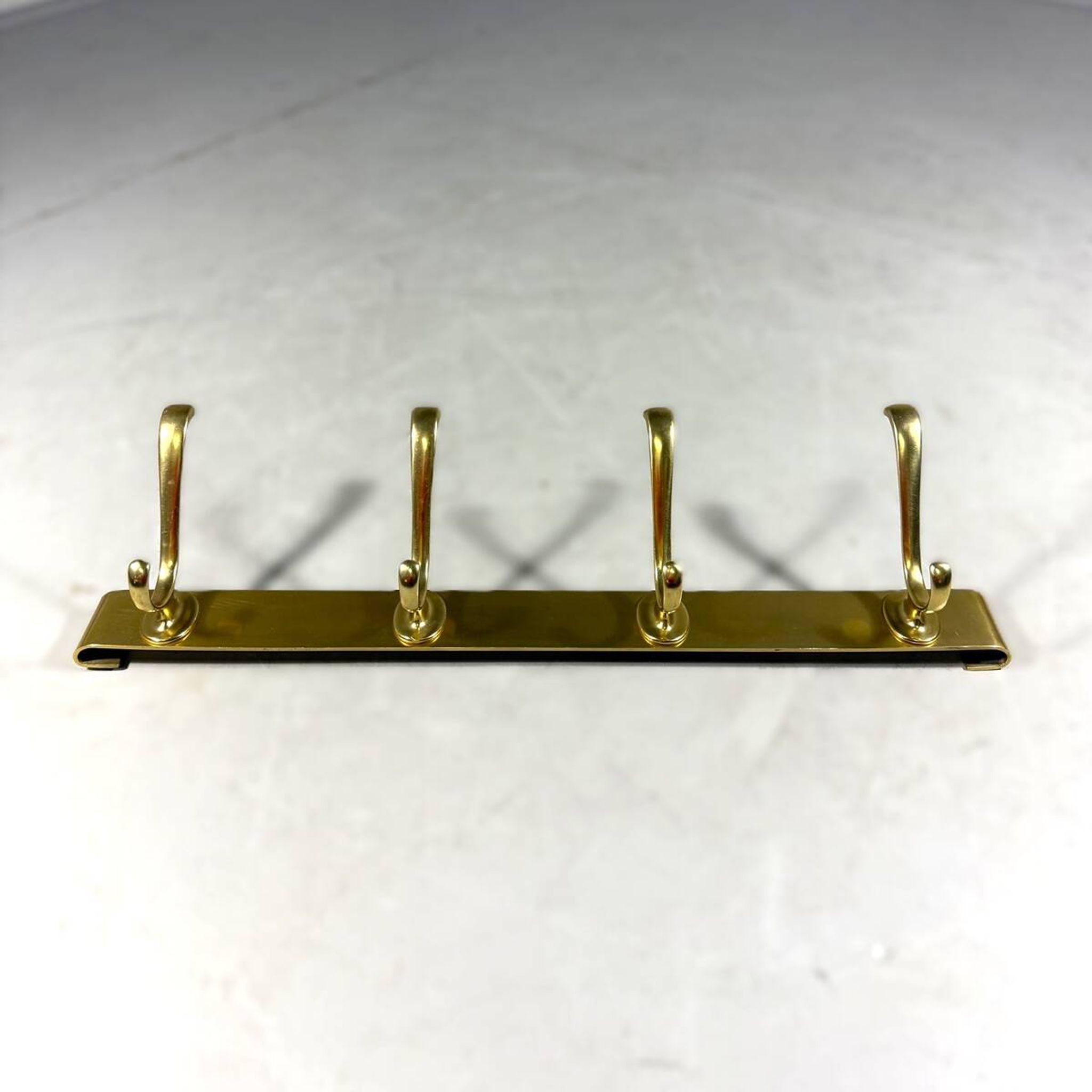 Gold coloured aluminium wall coat rack 1960’s