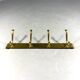 Gold coloured aluminium wall coat rack 1960’s