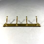 Gold coloured aluminium wall coat rack 1960’s