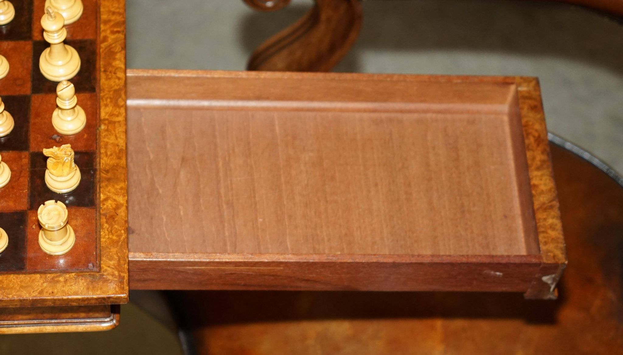 High Victorian leather tête-à-tête canapé with a walnut burr chessboard.